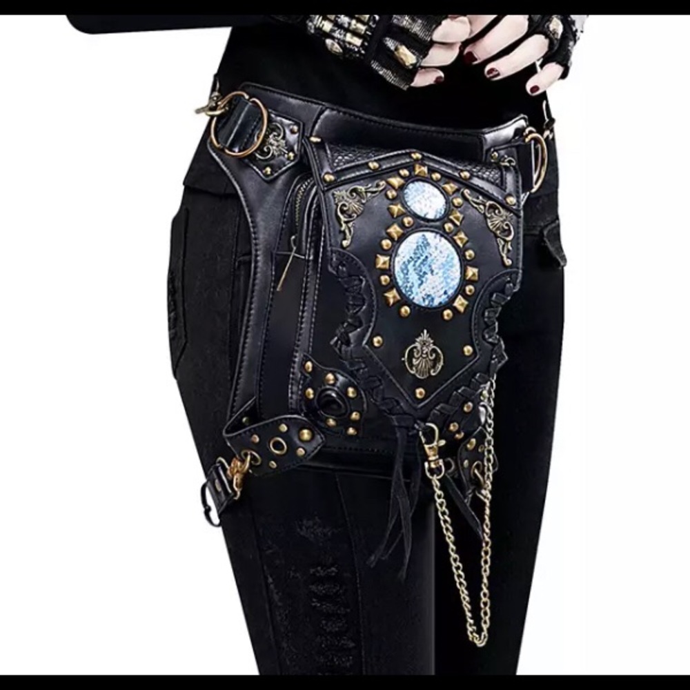 Sold NWOT Faux black leather holster bag.